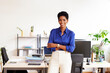 © ALTO IMAGES/Stocksy - Positive black female manager in light office