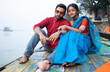 © Dream Lover/Stocksy - Young Indian couple enjoying romantic moments sitting beside River