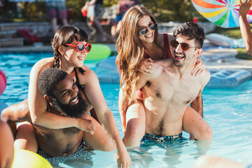 Poster - Party, pool and piggyback with a couple of friends having fun while swimming together outdoor during summer. Water, swim and diversity with a man and woman friend group playing games outside