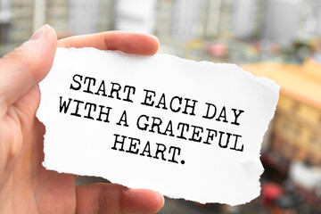 Wall Mural - Start each day with a grateful heart. Motivation concept text.