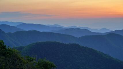 Wall Mural - View of the surrounding mountains from the Hadong gliding field in South Korea