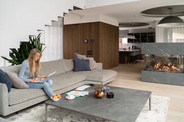 Woman Using Laptop At Home