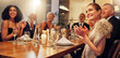 © Coetzee/peopleimages.com - People, restaurant and clapping at celebration in night for friends, business executive team or happy for success. New year, applause or gala party with champagne, congratulations or group motivation
