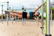 © David Prado/Stocksy - Muscular sportsman doing human lag exercise in park