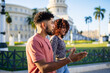© Daniel Gonzalez/Stocksy - Cuban man talking to woman during date