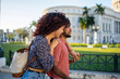 © Daniel Gonzalez/Stocksy - Cuban couple hugging and strolling on street