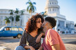 © Daniel Gonzalez/Stocksy - Loving couple kissing on street