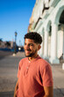 © Daniel Gonzalez/Stocksy - Happy Cuban man on street