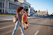 © Daniel Gonzalez/Stocksy - Cuban couple crossing road in city