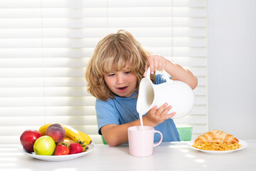 Wall Mural - Kid pouring whole cows milk. Healthy food, vegetable dish.