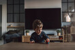 © Santi Nuñez/Stocksy - Happy Toddler playing car toy