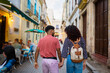 © Daniel Gonzalez/Stocksy - Cuban couple strolling on street