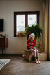 © Melissa Milis Photography/Stocksy - Boy with Christmas pajamas on Christmas day