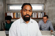 © Aleksandra Jankovic/Stocksy - Portrait Of A Black Businessman In The Office