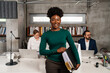 © Aleksandra Jankovic/Stocksy - Portrait Of Smiling Black Businesswoman In The Office