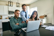 © Sean Locke/Stocksy - Couple Meets With Financial Advisor At Home