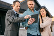 © Sean Locke/Stocksy - Agent Discusses Home Information On Tablet