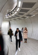 © Hernandez & Sorokina/Stocksy - Woman Using Phone Between Walking People