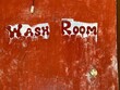 © Dream Lover/Stocksy - Wash Room written on an red painted wall