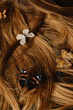 © Anastasia Mihaylova (Shpara)/Stocksy - Close up photo Of A Golden Blond wavy Hair with butterflies