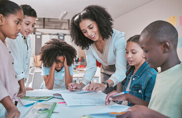 Poster - Female teacher helping children with assignment, classroom in school and writing notes in book. Diversity in student group, educator reading kids notebook and learning together for assessment