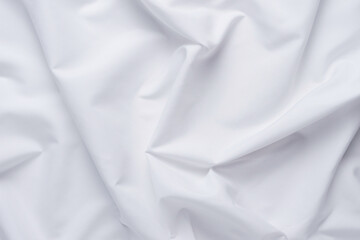 White fabric. luxurious white fabric texture background. Creases of satin, silk and cotton.	