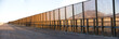 © Cavan Images - A pedestrian-style fence runs along the Mexican border in Arizona.