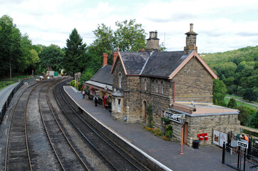 Wall Mural - Empty Platform on Heritage Railway Station  with Old Stone Buildings 