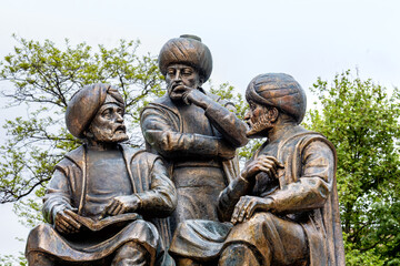 Memorial of Fatih Sultan Mehmed II the Conqueror. Three sages. Close up view, fragment of composition. Turkish monuments of the history of Constantinople. Fatih Park, Istanbul, Turkey (Turkiye)