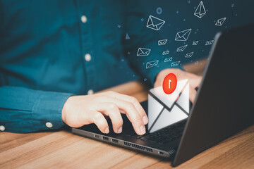 Poster - Man hand using a computer laptop and sending online message with email icon in the office. Concept of E-mail marketing and newsletters network, internet technology and life.