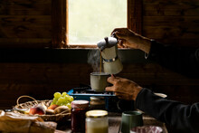 Man Making Coffe At Cozy Wooden Cabin
