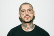 © Santi Nuñez/Stocksy - Casual Tattoo Man Portrait