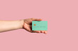 © Pixel Stories/Stocksy - Hand holding credit / debit card