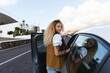 © Michela Ravasio/Stocksy - Woman getting into the car