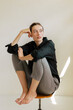 © Federica Giacomazzi/Stocksy - Portrait Of A Brunette Woman In Black Shirt and Gray Pants