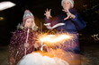 © Evgenij Yulkin/Stocksy - Children and little firework
