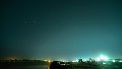 timelapse of river and port in northern europe city at night time. lantern lights in the urban view.