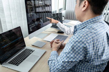 Leinwandbilder - Team of two professional programmers working on website projects in software development on the desktop computer and making coding and typing data code password security in office