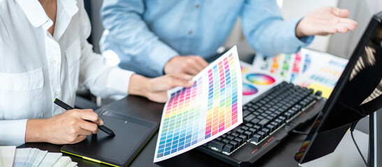 Poster - Two creative graphic designer team working on color selection an
