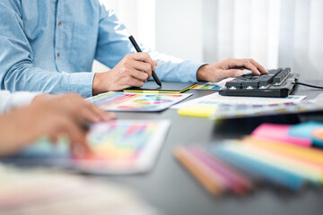 Poster - Team of creative graphic designer working on color swatch samples chart for selection coloring in inspiration to create new collection at workplace