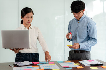 Aufkleber - Business executive team brainstorm and takes notes on keyword about a new business project for marketing planning together in the office