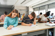 © EFStock - Multi ethnic teenager students taking exam at High School - Technical preparation course for University