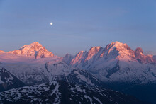 The Full Moon Over The Mont Blanc Range At Sunset In The French Alps.
