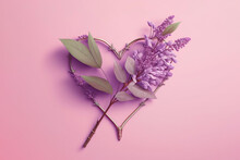 Wire Heart With A Lilac Branch In The Form Of An Arrow. Pink Background For Valentine's Day.