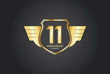 11 Years Anniversary Logotype 3D Golden Stylized Modern Shape Winged Shield On Black Background