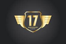 17 Years Anniversary Logotype 3D Golden Stylized Modern Shape Winged Shield On Black Background