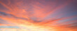 colorful sunset sky panorama with pink orange and yellow clouds