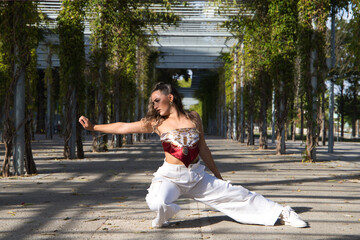 Wall Mural - woman dancing in the park