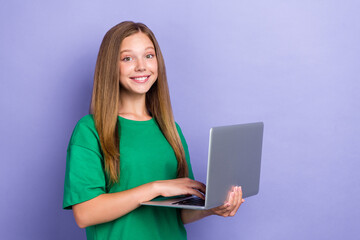 Sticker - Photo of positive pretty schoolkid pupil hold use netbook do homework empty space isolated on purple color background