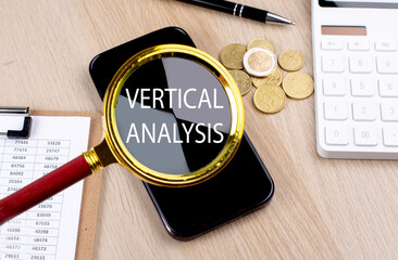 Poster - VERTICAL ANALYSIS text on the magnifier with smartphone, calculator and coins